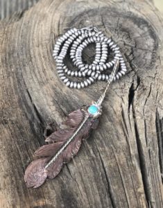 copper feather pendant